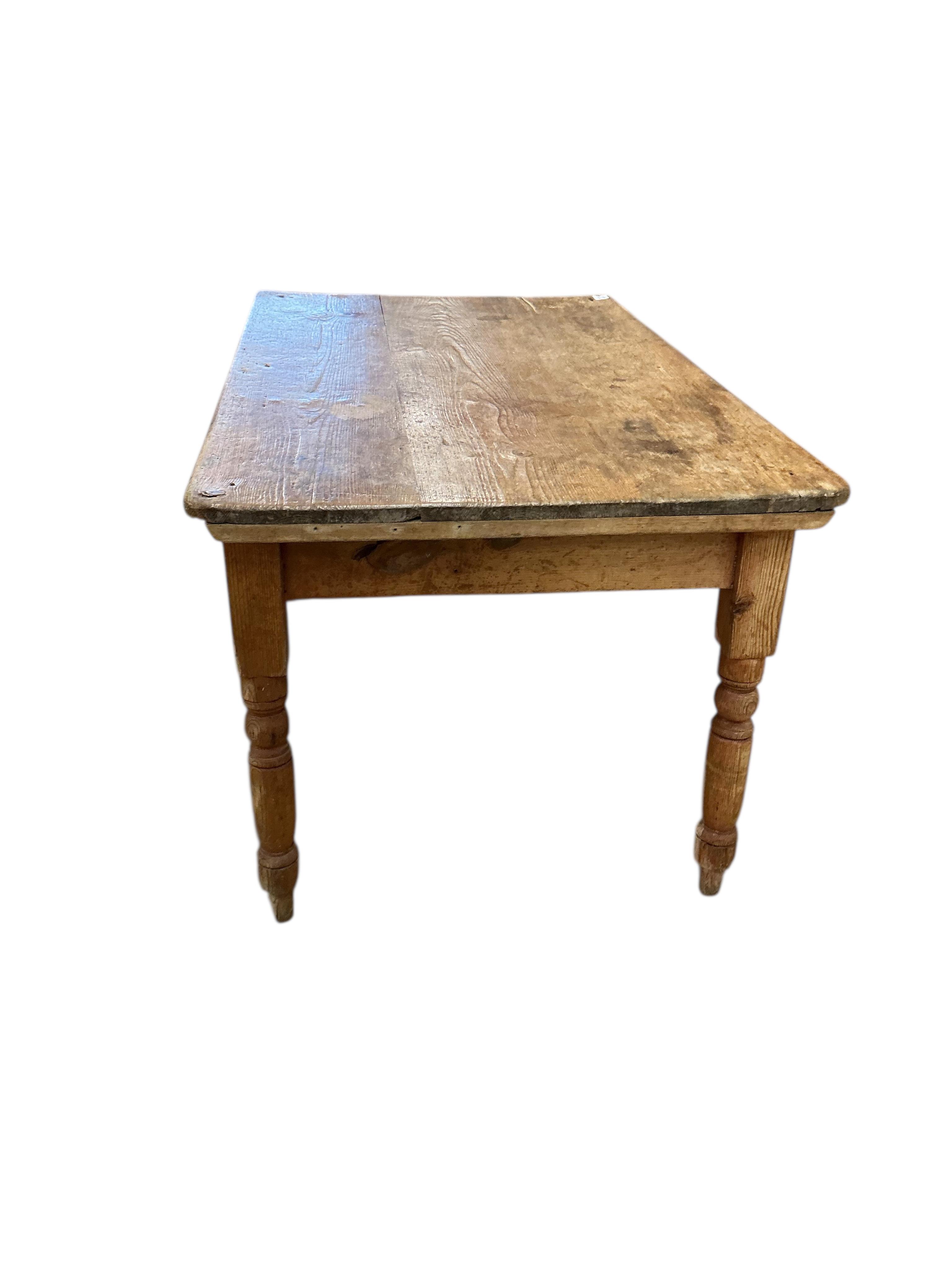 A Victorian rectangular pine kitchen table, width 133cm, depth 82cm, height 72cm together with four Victorian Windsor elm and beech comb back kitchen chairs